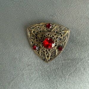 Vintage filigree broach with red stones
